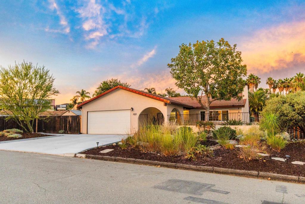 16327 Scarbery Road Ramona, CA 92065 - Photo 1 of 40 a front view of a house with a garden