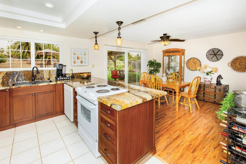 16327 Scarbery Road Ramona, CA 92065 - Photo 12 of 40 a kitchen with a sink stove and cabinets