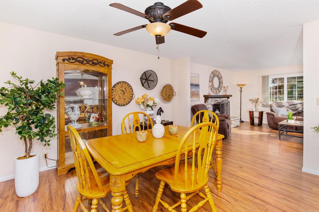 16327 Scarbery Road Ramona, CA 92065 - Photo 14 of 40 a view of a dining room with furniture and wooden floor