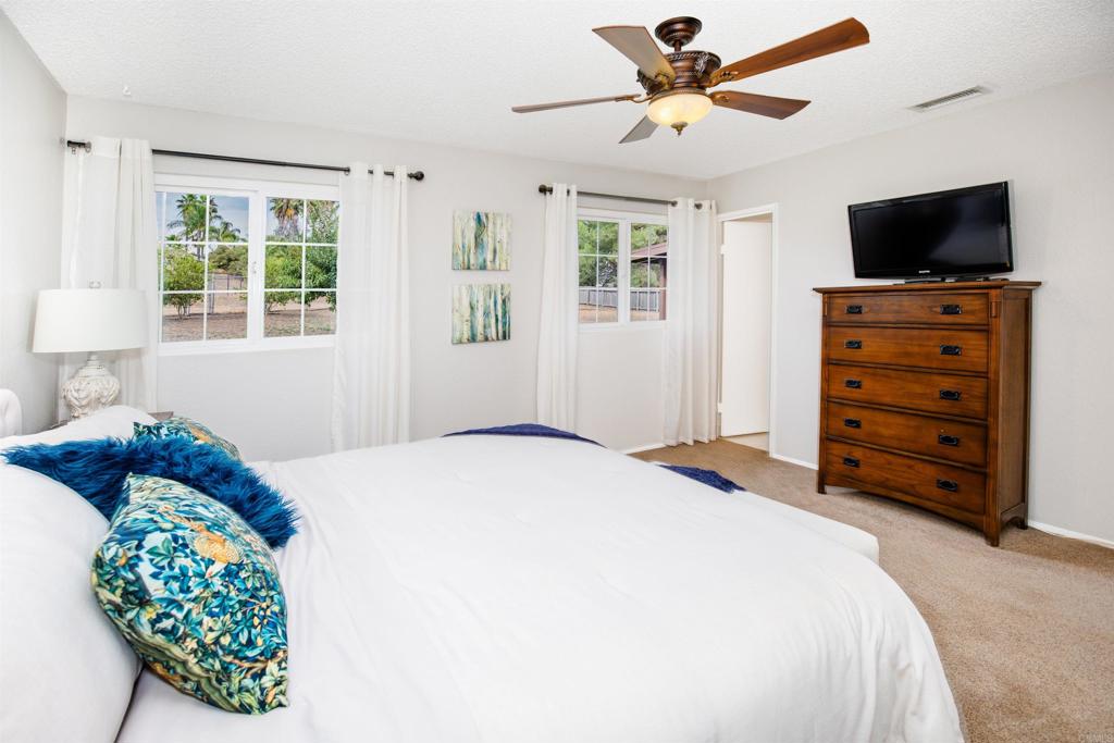 16327 Scarbery Road Ramona, CA 92065 - Photo 15 of 40 a bedroom with a bed dresser and a window