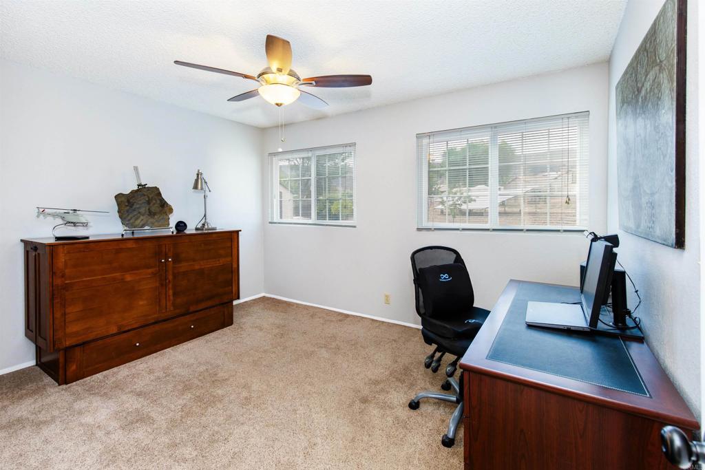 16327 Scarbery Road Ramona, CA 92065 - Photo 16 of 40 a view of a workspace with furniture and a window