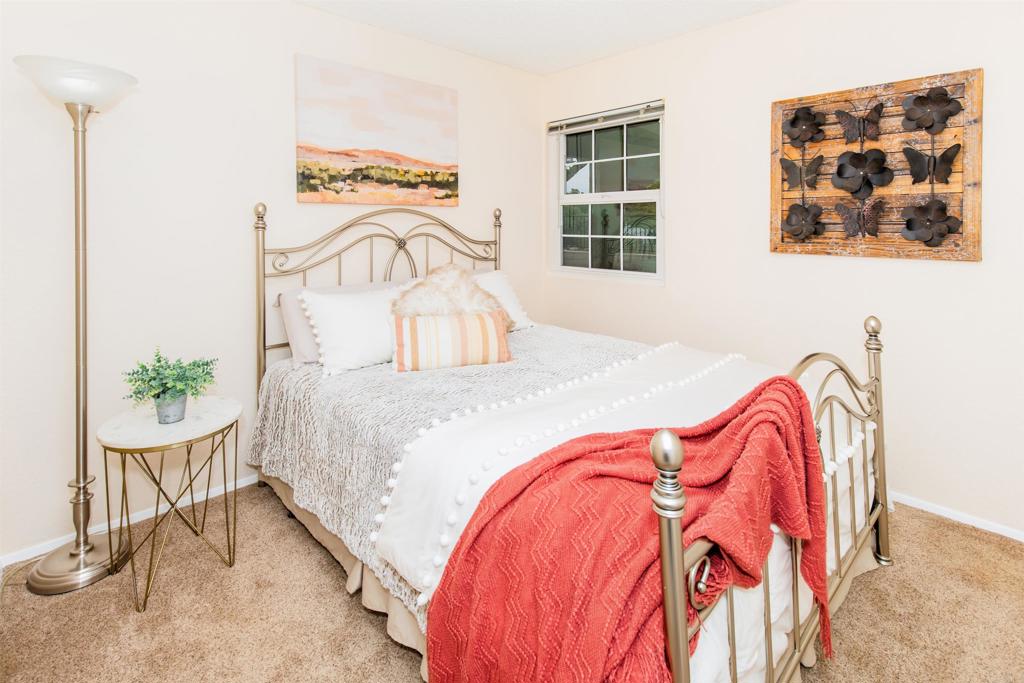 16327 Scarbery Road Ramona, CA 92065 - Photo 17 of 40 a bedroom with a bed and dresser with mirror