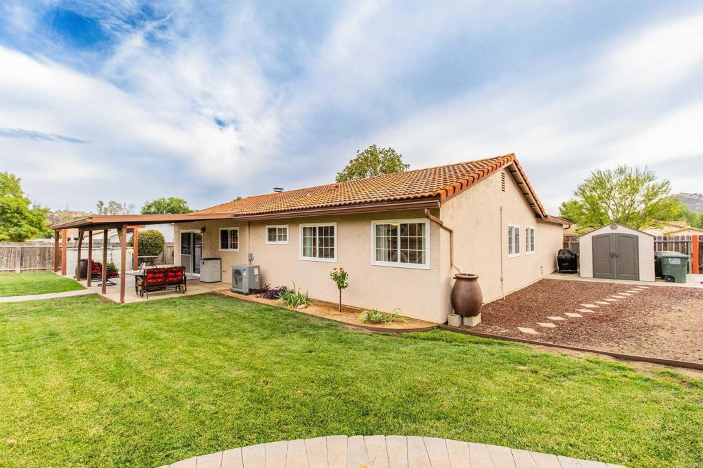 16327 Scarbery Road Ramona, CA 92065 - Photo 33 of 40 a view of a house with a yard