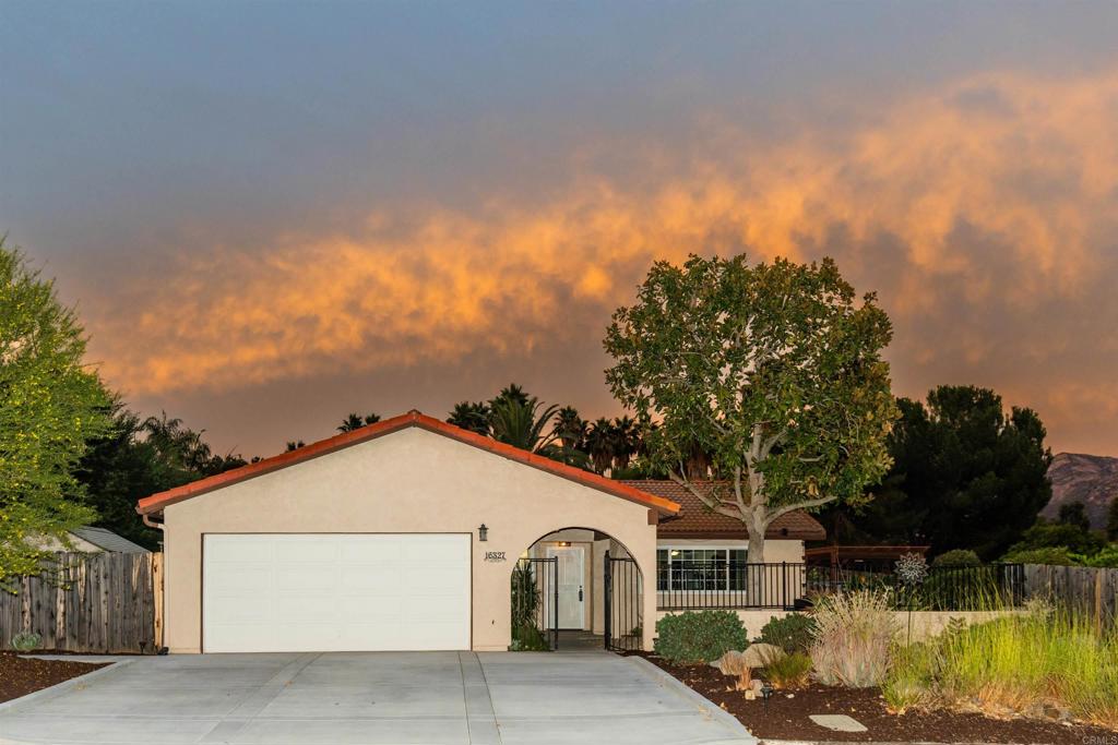 16327 Scarbery Road Ramona, CA 92065 - Photo 37 of 40 a front view of a house with a yard and garage