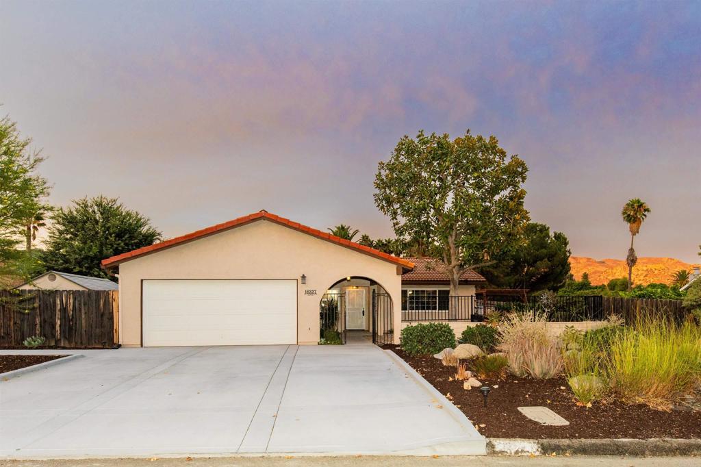 16327 Scarbery Road Ramona, CA 92065 - Photo 40 of 40 a front view of a house with a yard and garage