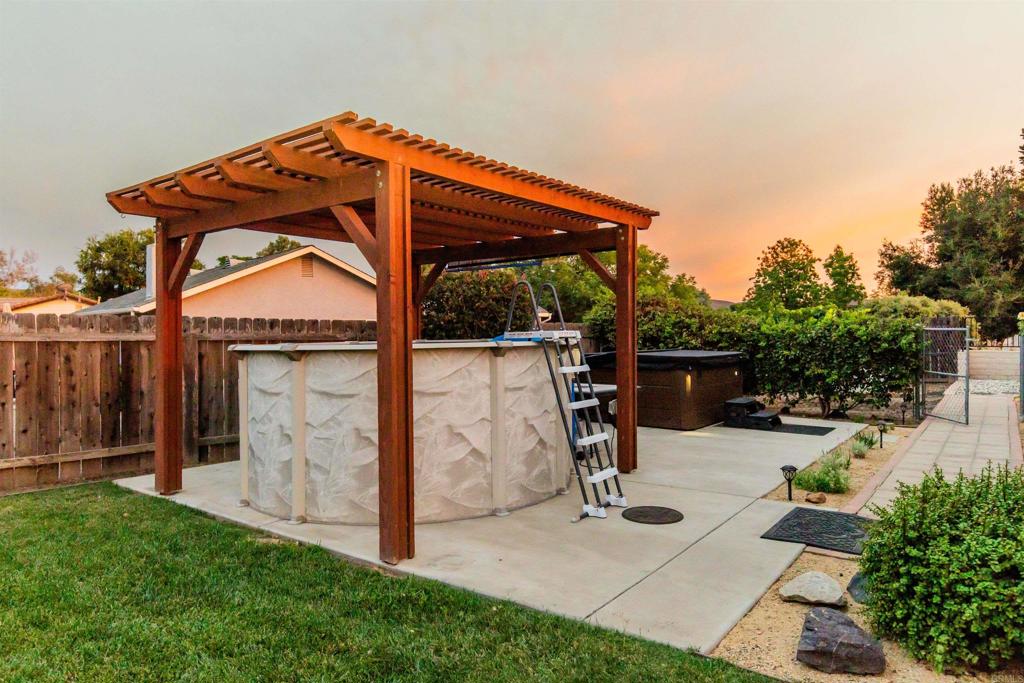 16327 Scarbery Road Ramona, CA 92065 - Photo 4 of 40 a view of backyard with a garden and seating space