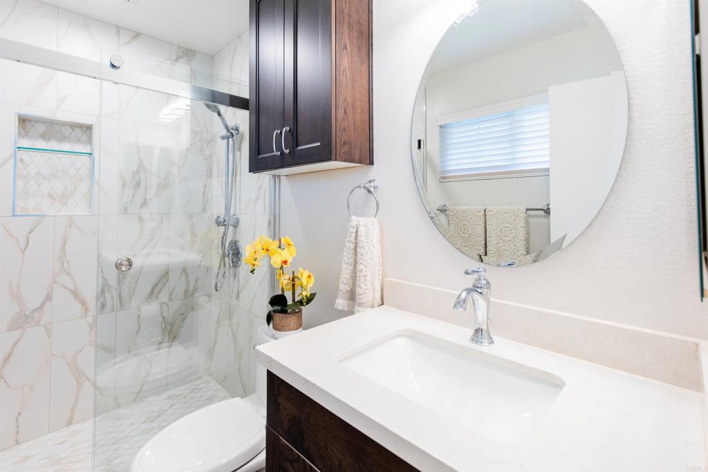 16327 Scarbery Road Ramona, CA 92065 - Photo 6 of 40 a bathroom with a sink a toilet and shower