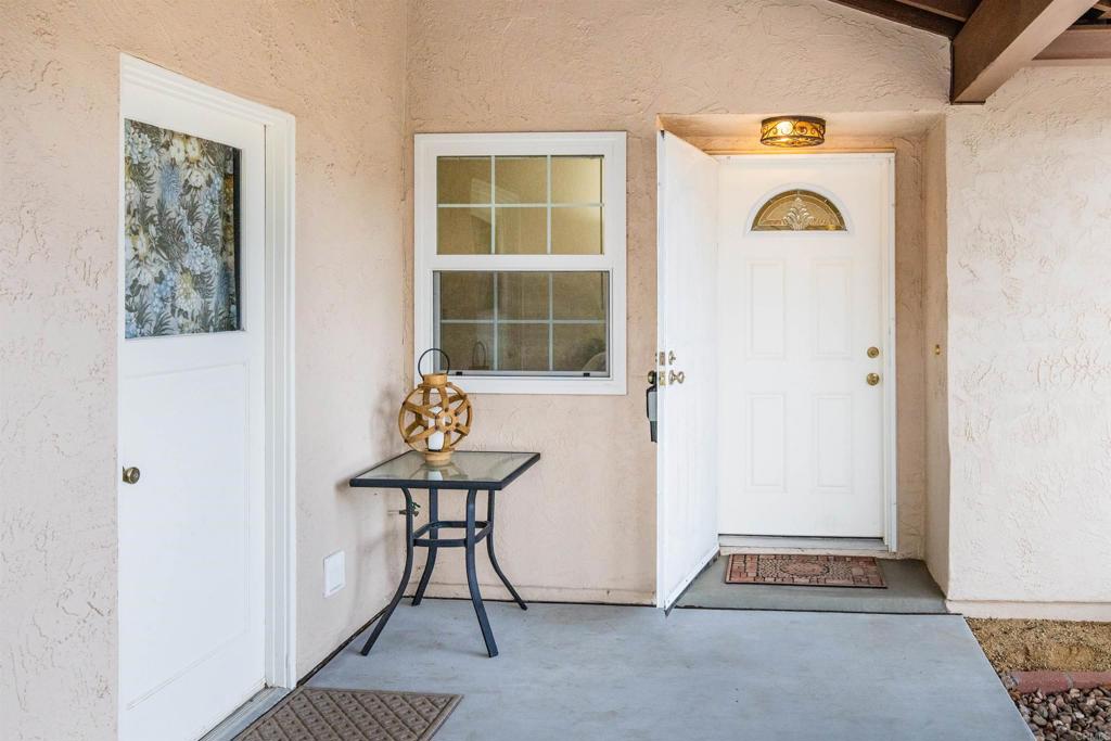16327 Scarbery Road Ramona, CA 92065 - Photo 7 of 40 a room that has a bench and a table in it
