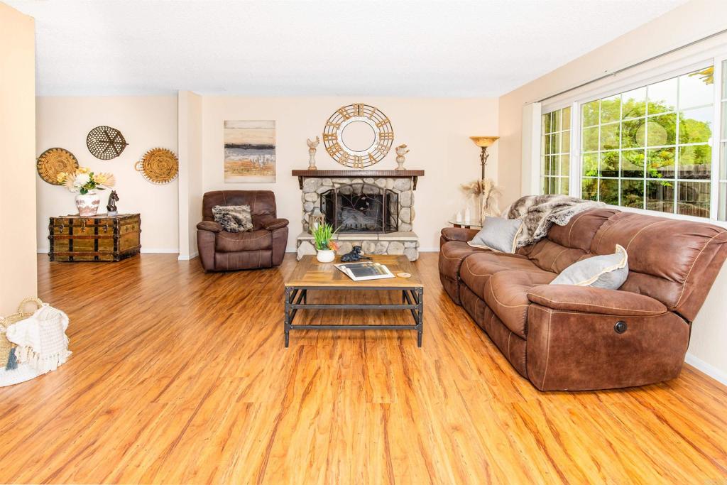 16327 Scarbery Road Ramona, CA 92065 - Photo 8 of 40 a living room with furniture and a fireplace