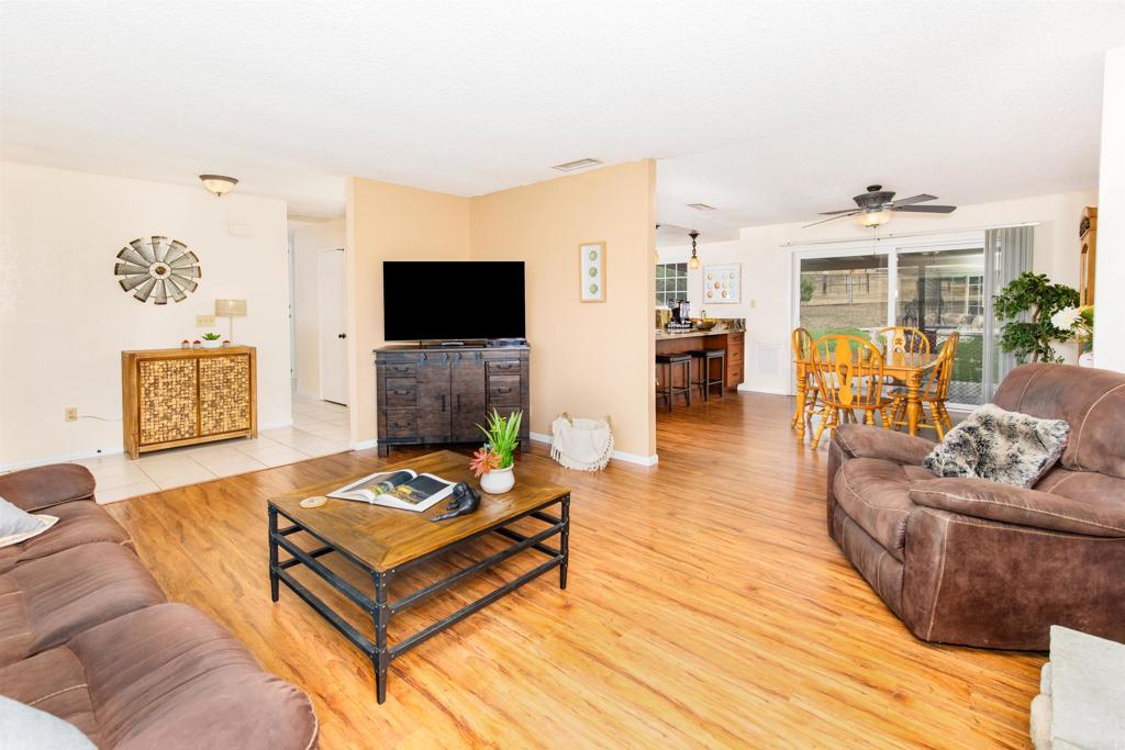 16327 Scarbery Road Ramona, CA 92065 - Photo 9 of 40 a living room with furniture and a flat screen tv