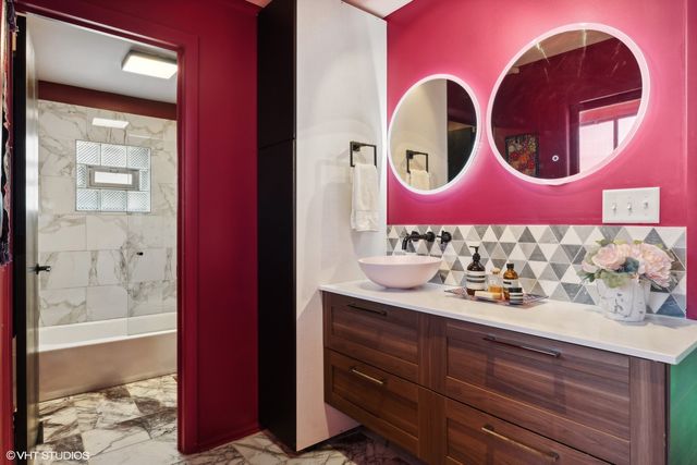 a bathroom with a sink and a mirror