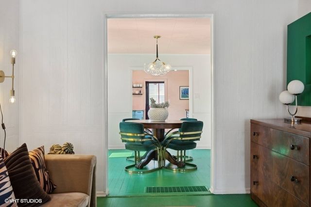 a living room with furniture and a clock