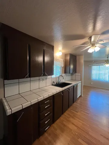 a large bathroom with a double vanity sink and a mirror