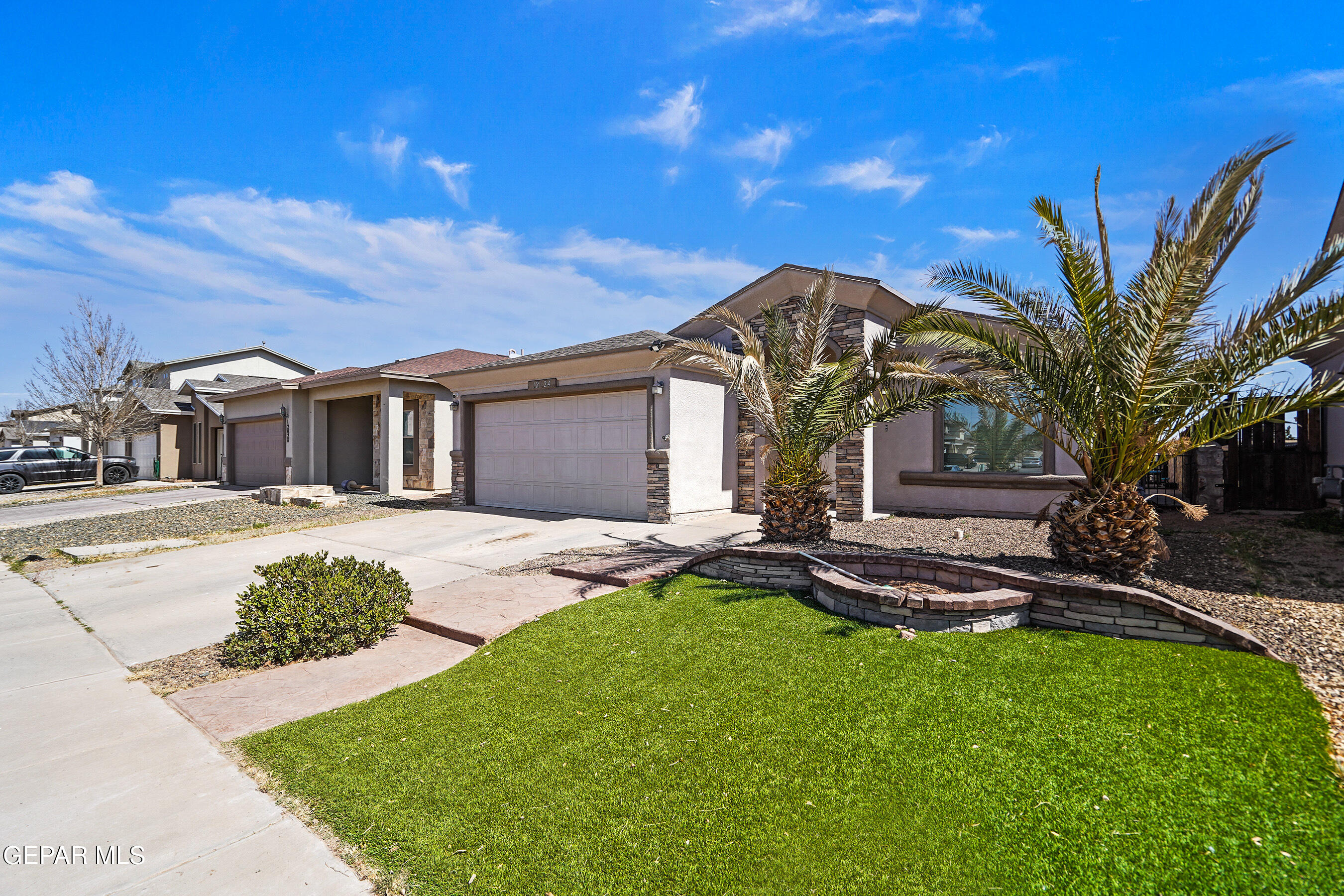 12024 Prairie Ridge Street El Paso, TX 79934 - Photo 1 of 1 a front view of a house with garden