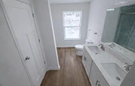 a bathroom with a glass shower door