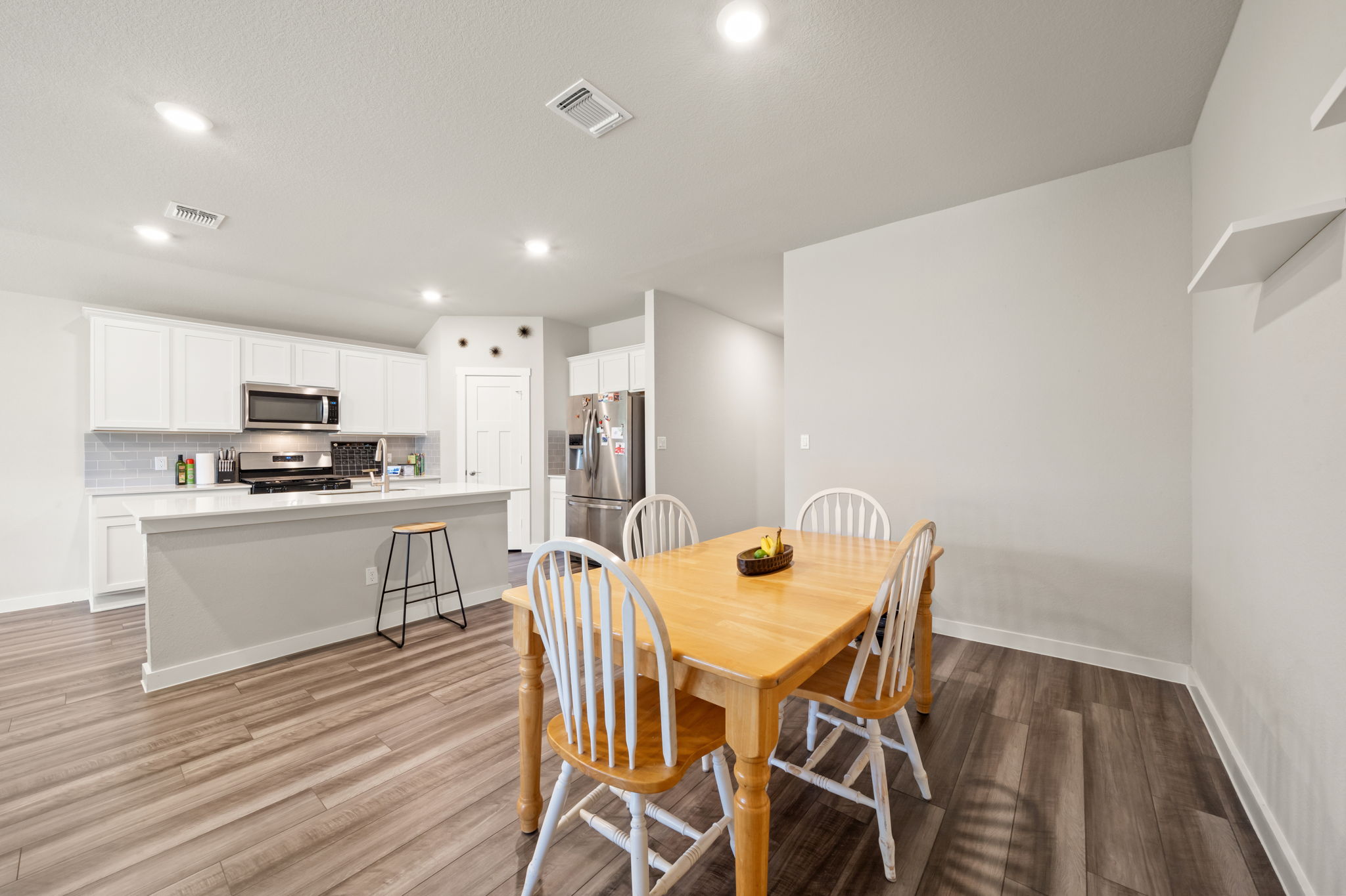 1117 Tipton Street Georgetown, TX 78633 - Photo 9 of 40 Kitchen and dining area featuring wood-finish flooring