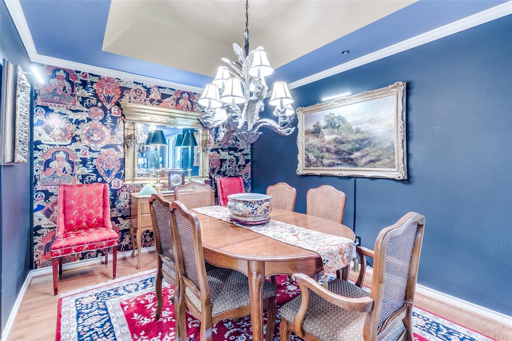 5909 Luther Lane, Unit 2104 Dallas, TX 75225 - Photo 11 of 22 a view of a dining room with furniture and chandelier