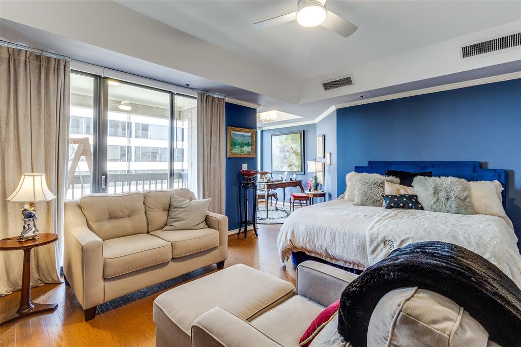 5909 Luther Lane, Unit 2104 Dallas, TX 75225 - Photo 14 of 22 a bedroom with a bed and a couch