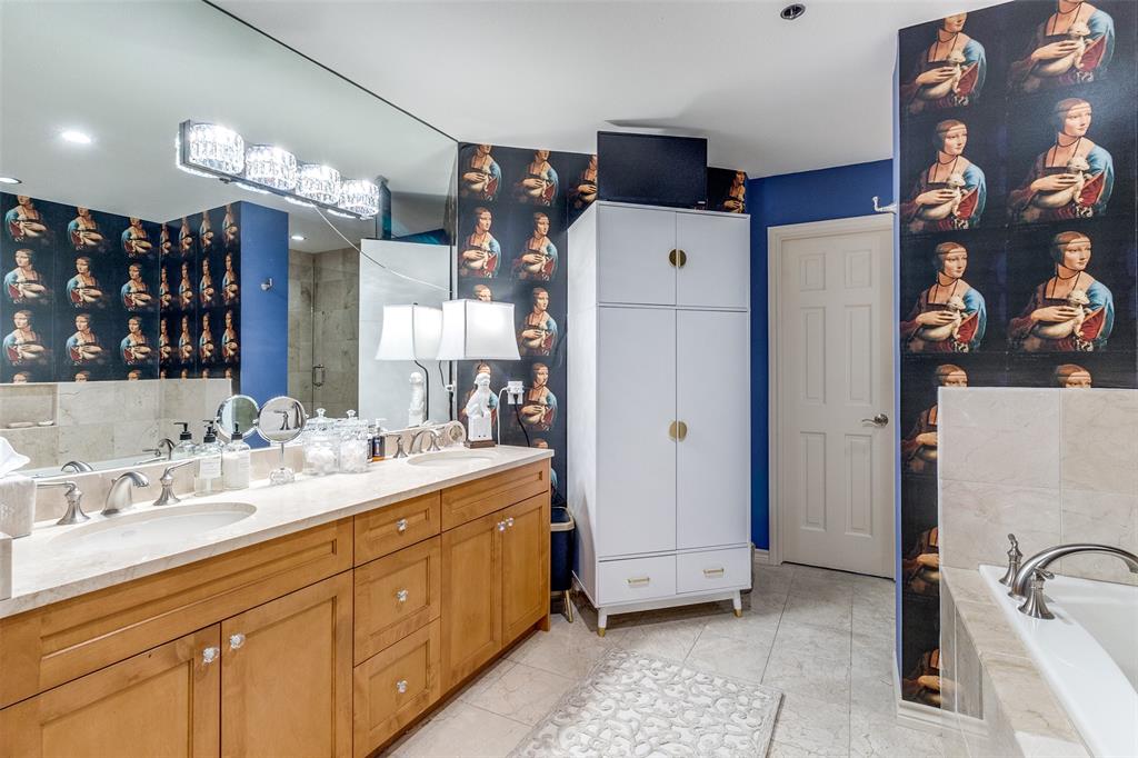 5909 Luther Lane, Unit 2104 Dallas, TX 75225 - Photo 19 of 22 a spacious bathroom with a sink and mirror with shower