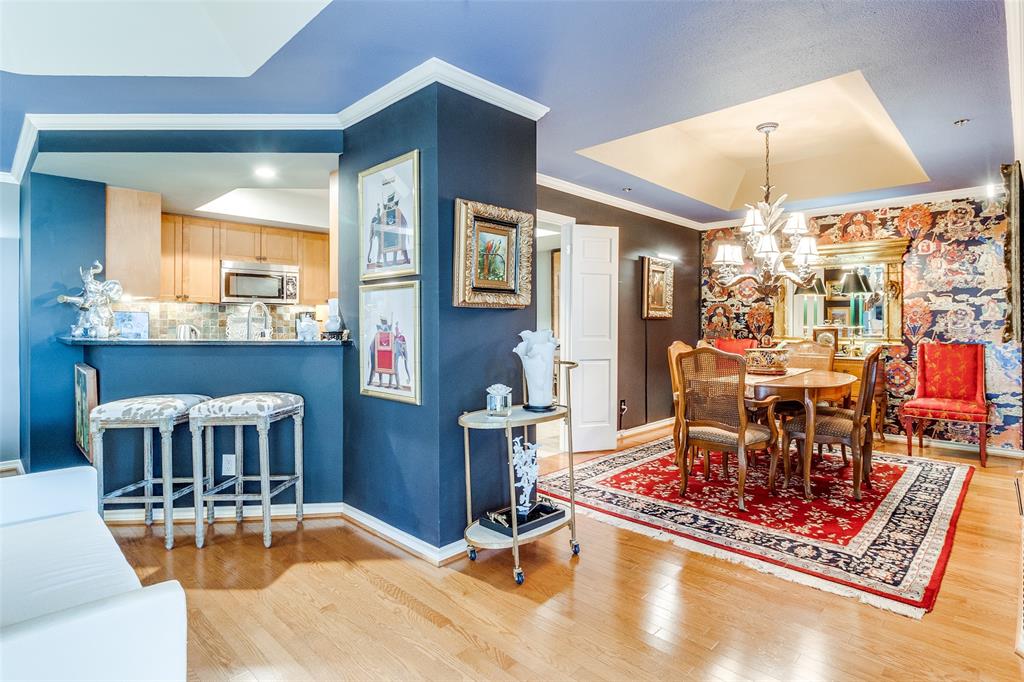 5909 Luther Lane, Unit 2104 Dallas, TX 75225 - Photo 6 of 22 a living room with furniture and a chandelier