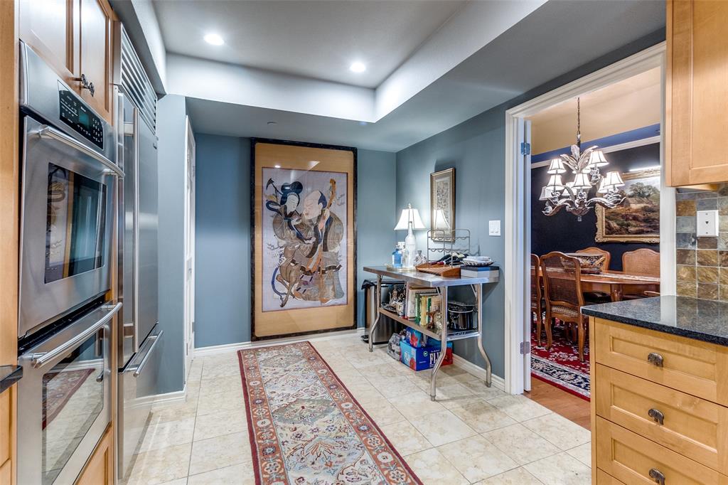 5909 Luther Lane, Unit 2104 Dallas, TX 75225 - Photo 9 of 22 a view of a hallway with workspace and window