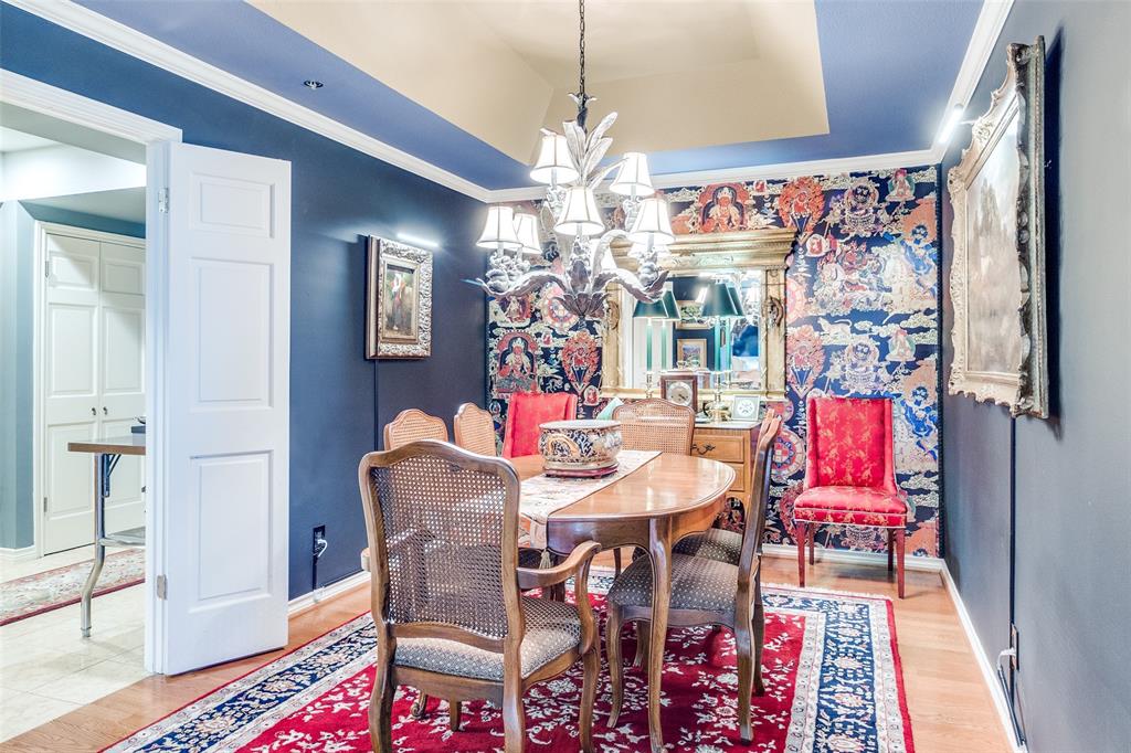 5909 Luther Lane, Unit 2104 Dallas, TX 75225 - Photo 10 of 22 a view of a dining room with furniture and chandelier