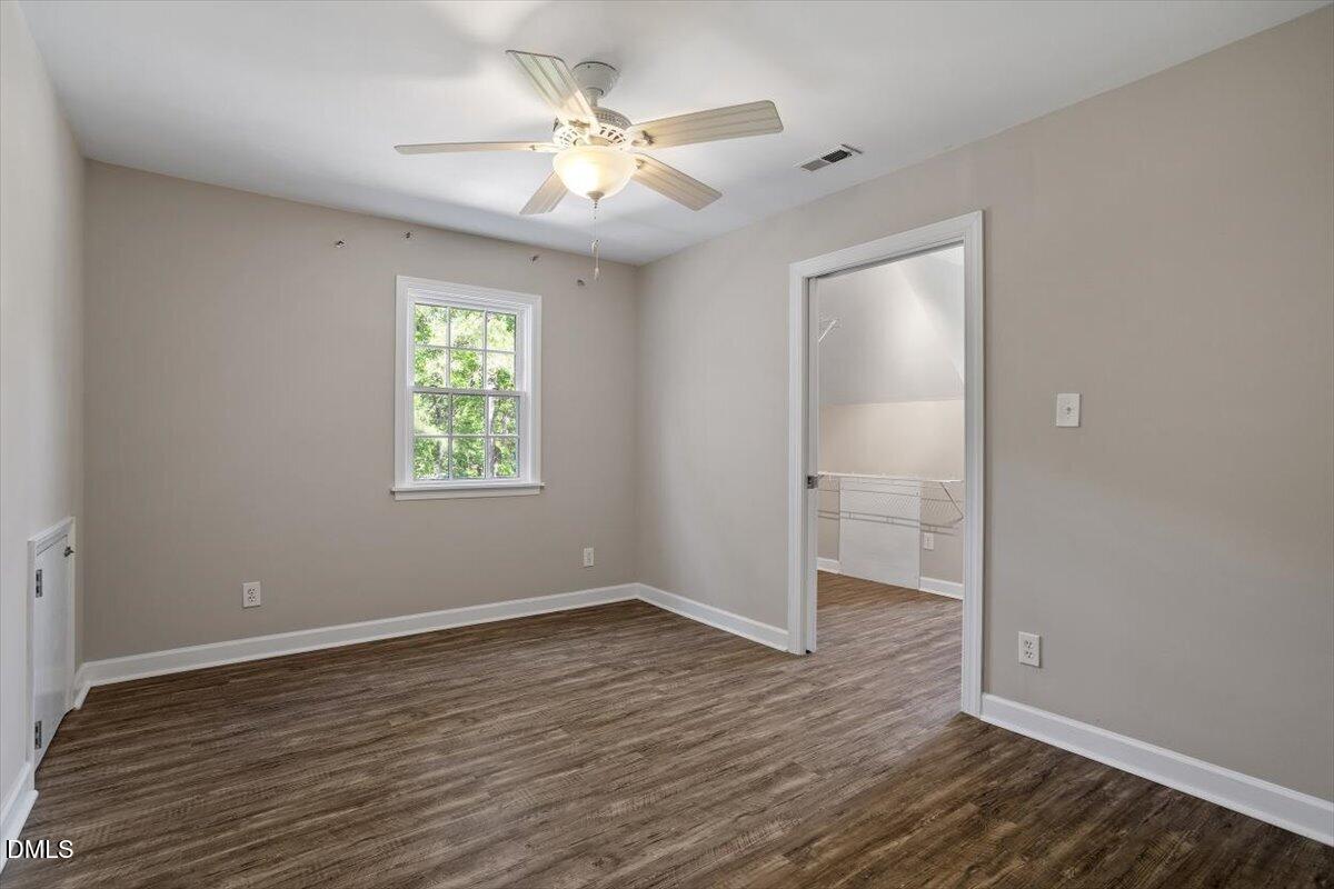 7505 Penny Road Raleigh, NC 27606 - Photo 35 of 35 wooden floor in an empty room with a window