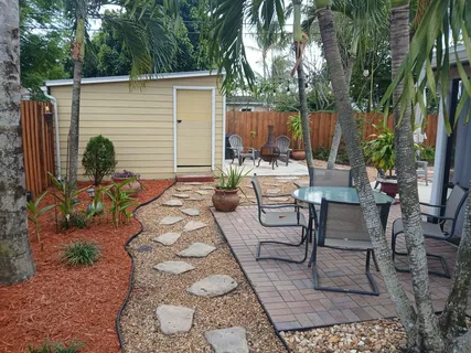 a view of a backyard with furniture