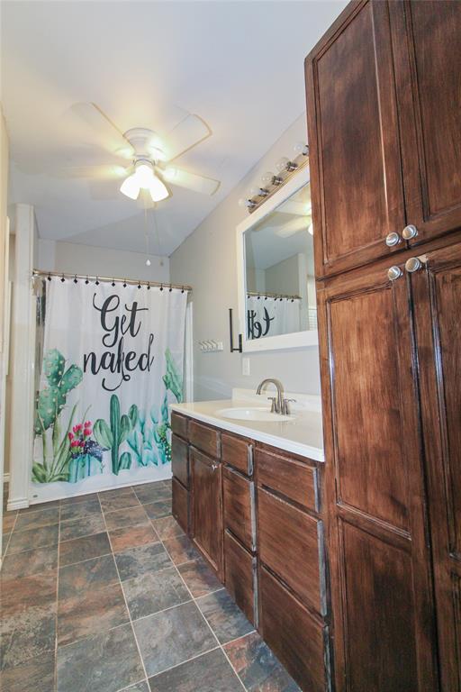 455 Hughes Cemetery Road Italy, TX 76651 - Photo 32 of 40 a bathroom with a sink and mirror