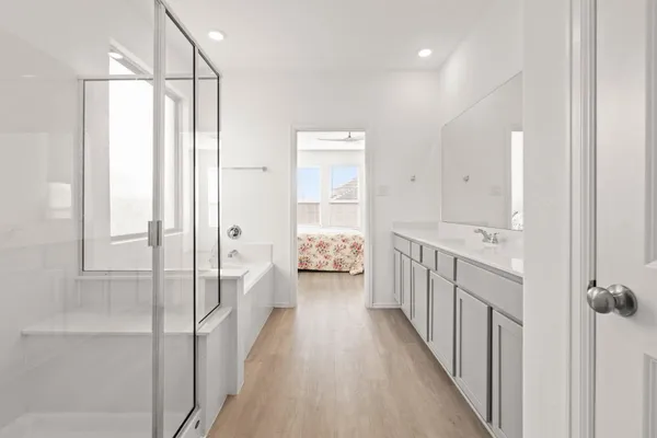 a bathroom with a double vanity sink and mirror