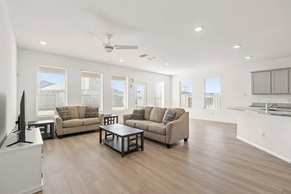 a living room with furniture and a large window