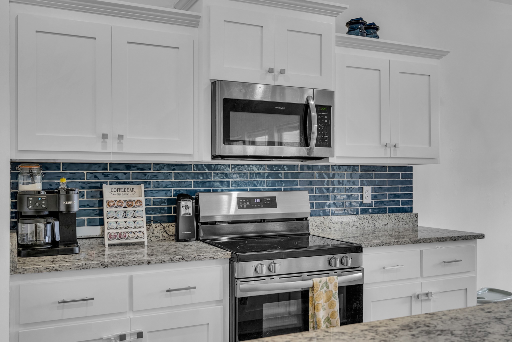415 Old Morrison Road McMinnville, TN 37110 - Photo 2 of 20 a kitchen with granite countertop white cabinets stainless steel appliances and a counter space