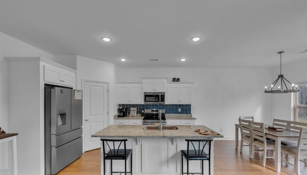 415 Old Morrison Road McMinnville, TN 37110 - Photo 4 of 20 a kitchen with stainless steel appliances granite countertop a sink a stove a refrigerator and white cabinets