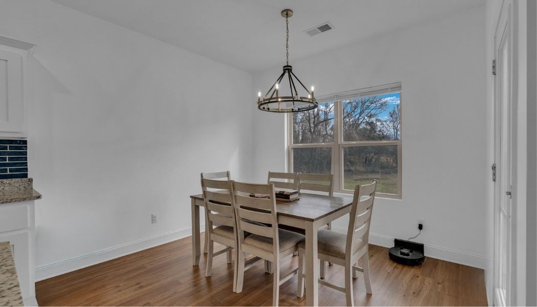 415 Old Morrison Road McMinnville, TN 37110 - Photo 6 of 20 a view of a dining room with furniture wooden floor and a chandelier
