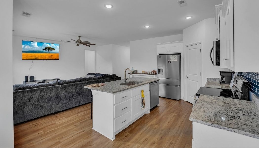 415 Old Morrison Road McMinnville, TN 37110 - Photo 7 of 20 a kitchen with stainless steel appliances granite countertop a sink stove and refrigerator