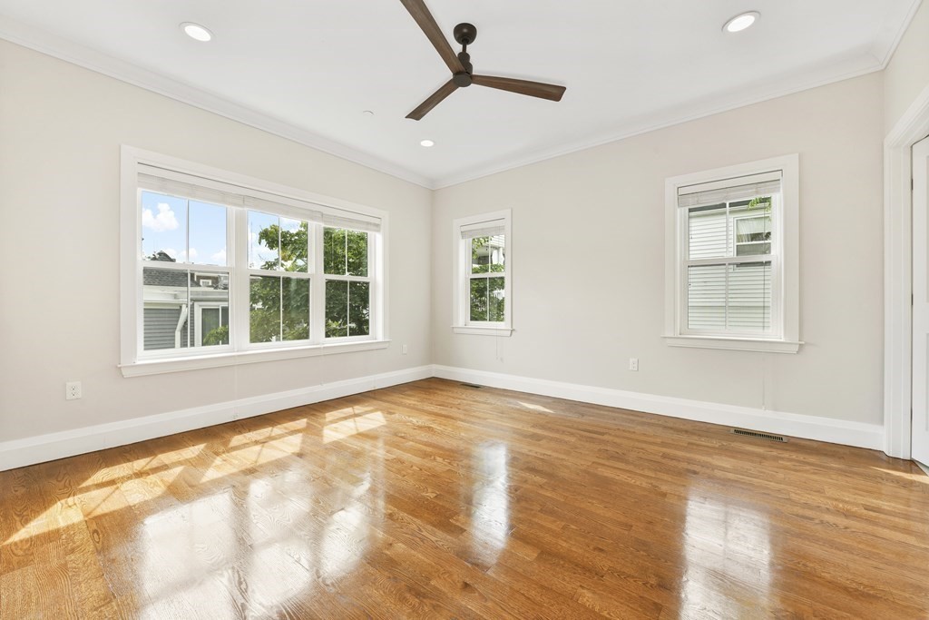 1514 R Columbia Road, Unit 2 Boston, MA 02127 - Photo 16 of 28 a view of an empty room with a window and wooden floor