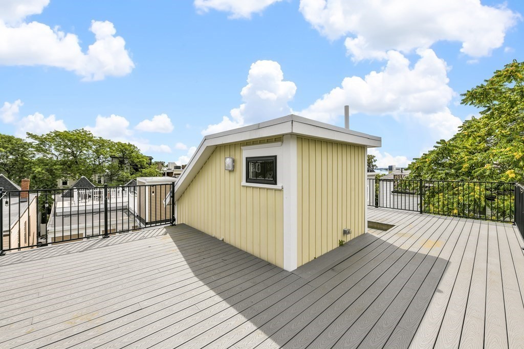 1514 R Columbia Road, Unit 2 Boston, MA 02127 - Photo 22 of 28 a view of a house with a roof deck