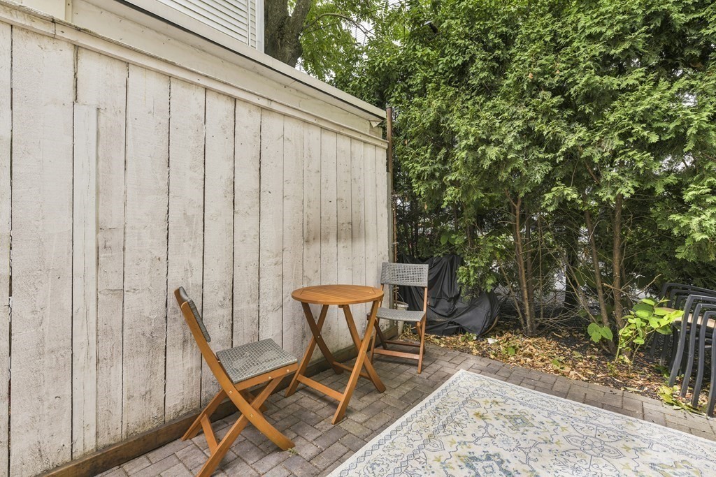 1514 R Columbia Road, Unit 2 Boston, MA 02127 - Photo 25 of 28 a patio with table and chairs and potted plants