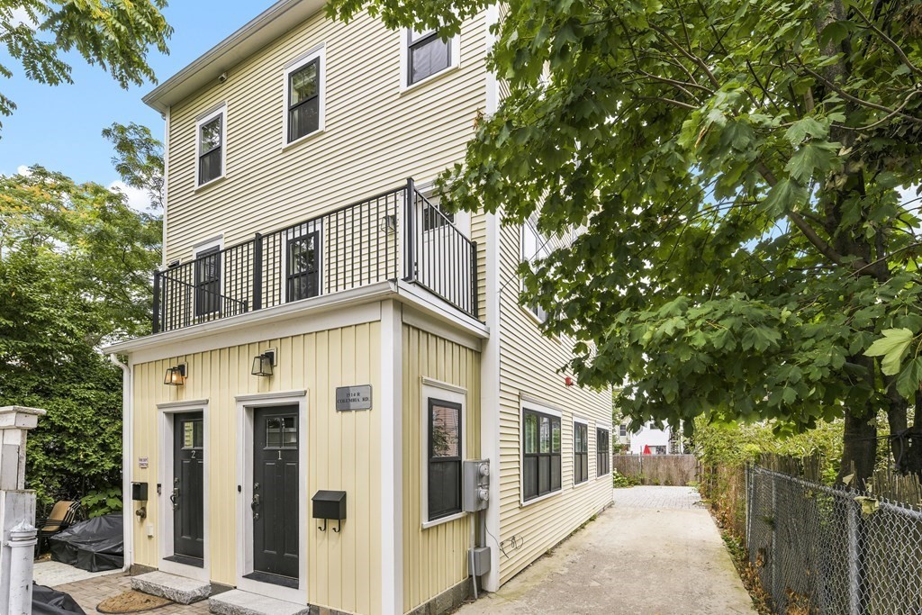 1514 R Columbia Road, Unit 2 Boston, MA 02127 - Photo 26 of 28 a front view of a house with a tree