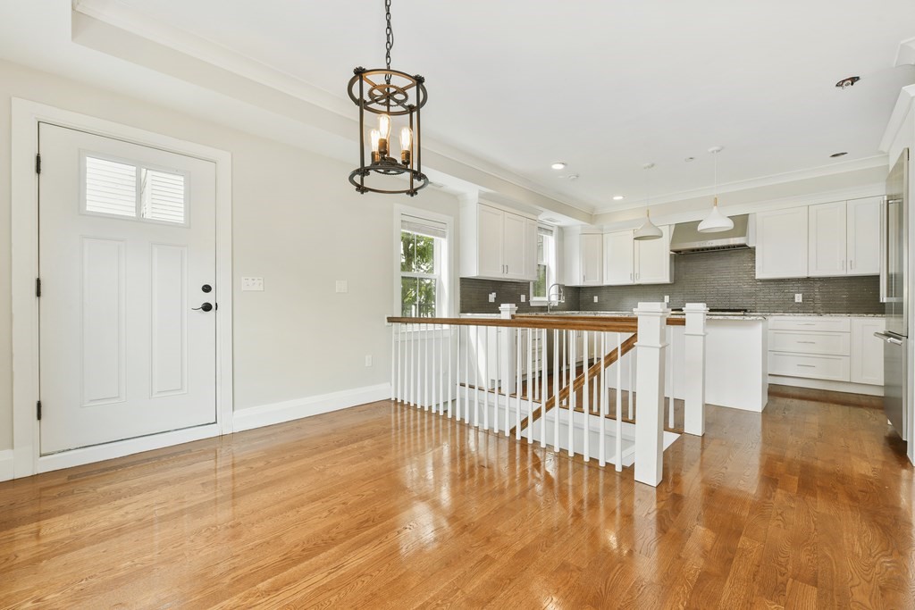 1514 R Columbia Road, Unit 2 Boston, MA 02127 - Photo 4 of 28 a view of kitchen with stainless steel appliances granite countertop a stove top oven a sink and a refrigerator