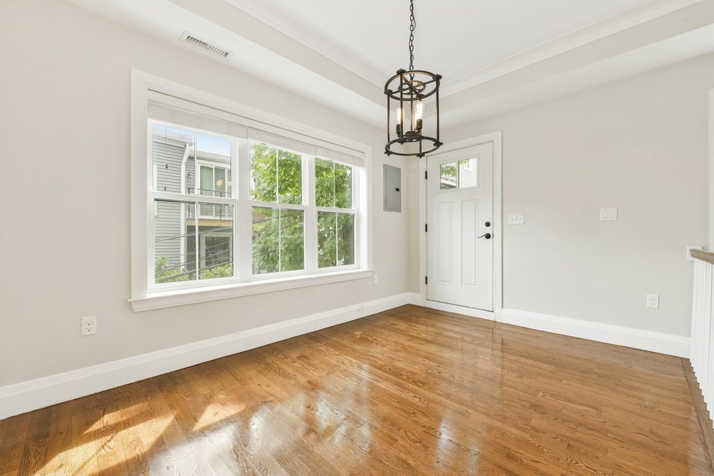 1514 R Columbia Road, Unit 2 Boston, MA 02127 - Photo 7 of 28 a view of empty room with a window and chandelier