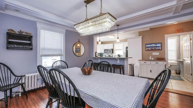 a dining room with furniture and window