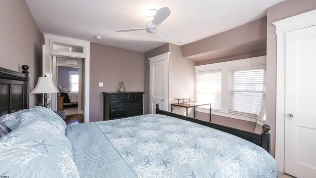 a bedroom with a bed and a dresser