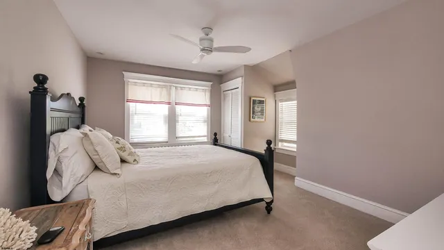 a bed room with a bed and a television