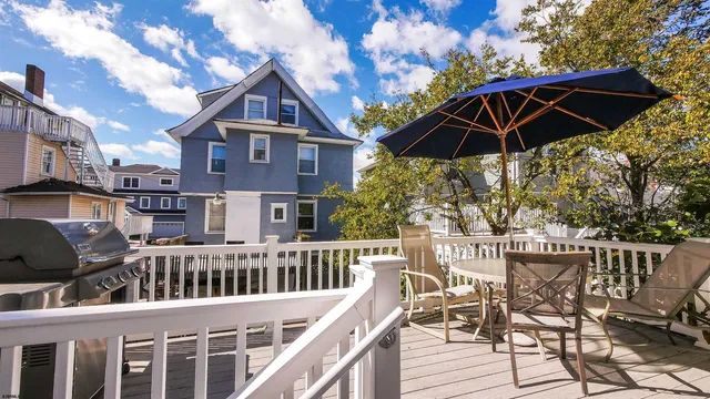 a view of balcony with outdoor seating and wooden floor