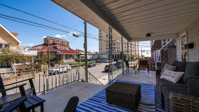 a outdoor living space with patio furniture and a potted plant