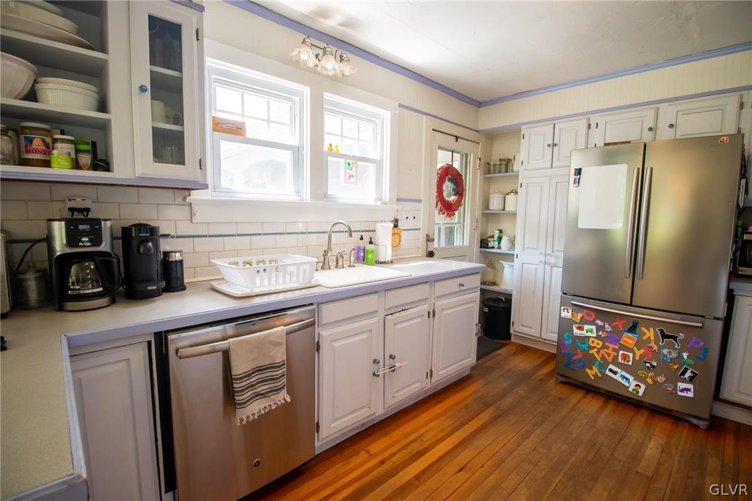 817 Easton Road Riegelsville, PA 18077 - Photo 11 of 43 a kitchen with stainless steel appliances a refrigerator sink and wooden floor