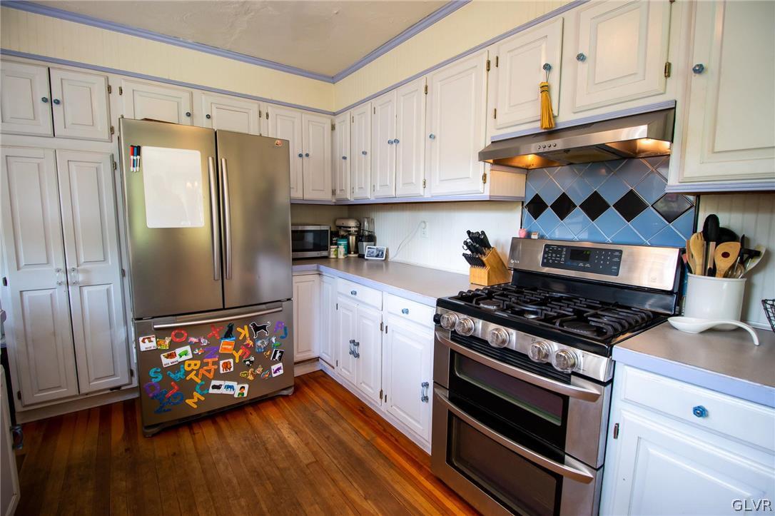 817 Easton Road Riegelsville, PA 18077 - Photo 12 of 43 a kitchen with stainless steel appliances a stove a refrigerator and a refrigerator