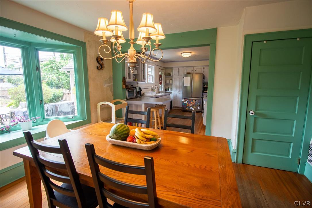 817 Easton Road Riegelsville, PA 18077 - Photo 14 of 43 a view of a dining room with furniture and a chandelier
