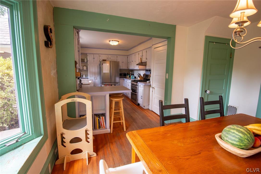 817 Easton Road Riegelsville, PA 18077 - Photo 15 of 43 a view of a dining room with furniture and wooden floor